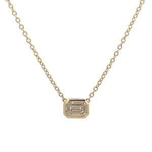 This 14k yellow gold necklace features round brilliant cut and bagu...
