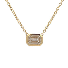 This 14k yellow gold necklace features round brilliant cut and bagu...