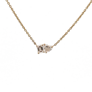 This necklace features 2 diamonds, a heart shape diamond and an eme...