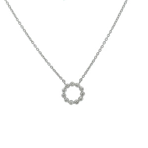 A circle pendant on a 14k white gold chain features round brilliant...