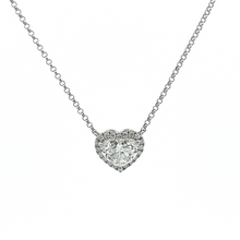 This 14k white gold necklace features a heart shape diamond that we...