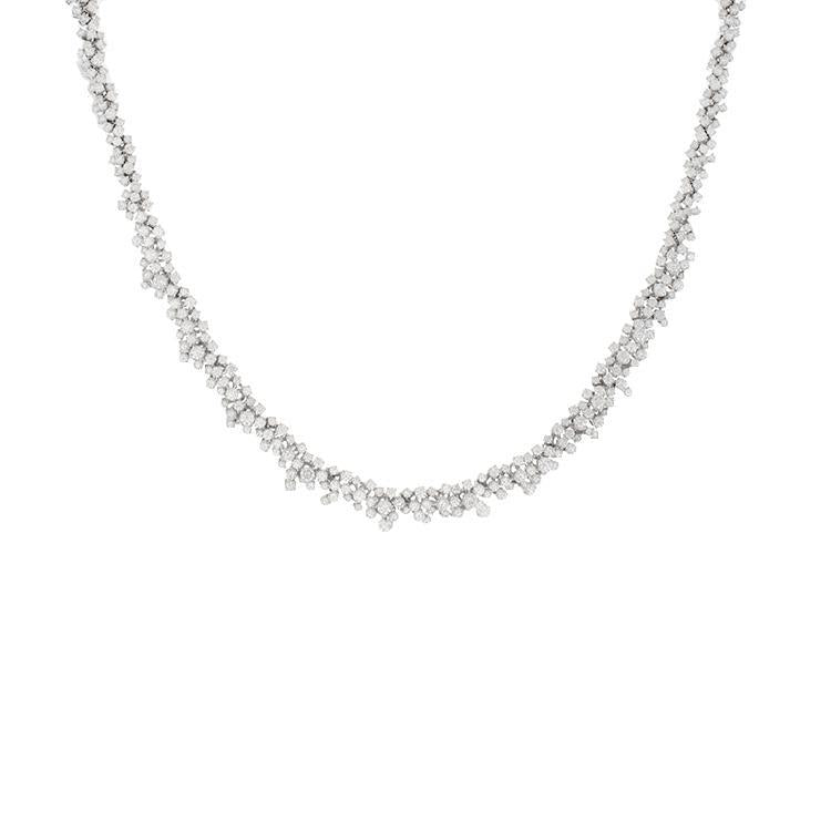 This diamond necklace features round brilliant cut diamonds that to...