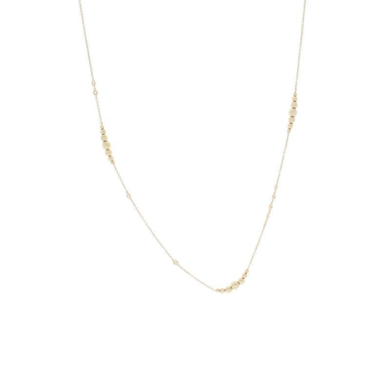 This necklace features yellow gold beads with bezel set round brill...