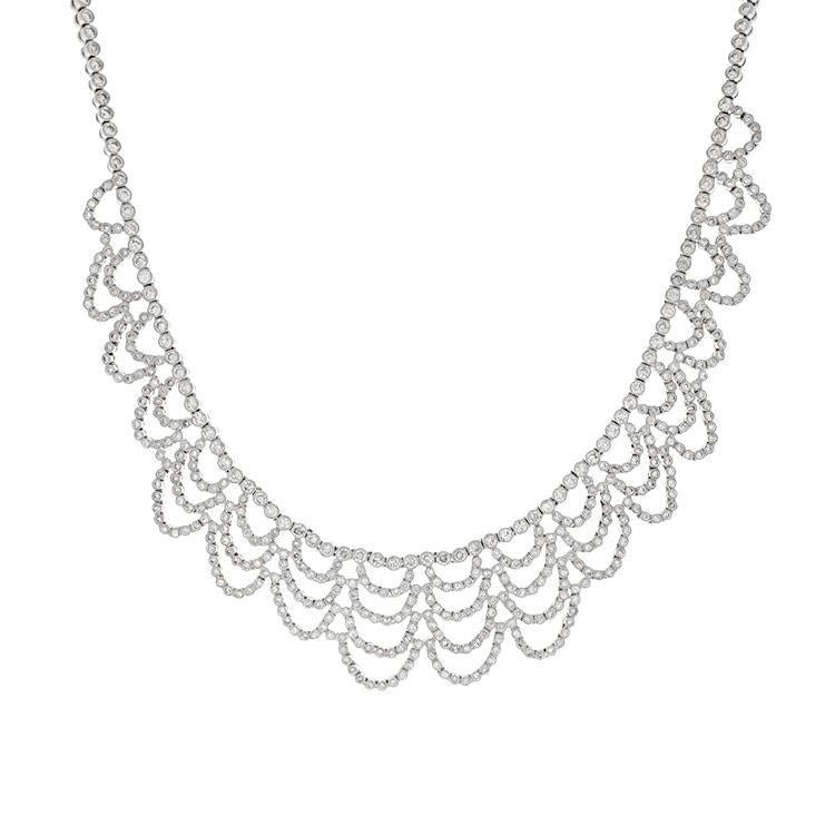 This necklace features round brilliant cut diamonds that total 10.0...