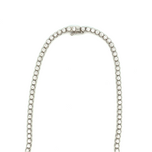 This stunning 18k white gold diamond necklace features round brilli...