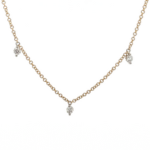This 14k yellow gold necklace features 7 round brilliant cut diamon...