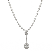 This gorgeous necklace features round brilliant cut and baguette cu...