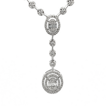 This gorgeous necklace features round brilliant cut and baguette cu...
