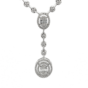 This gorgeous necklace features round brilliant cut and baguette cu...