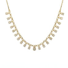 This 18k yellow gold necklace features round brilliant cut diamonds...