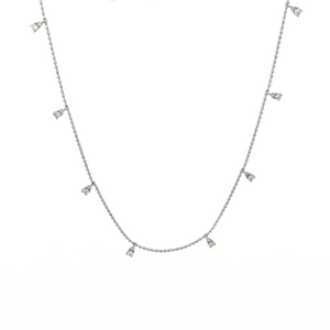 This dainty 14k white gold necklace features diamond drops that tot...