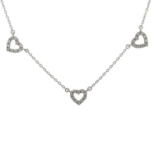 This 14k white gold necklace features 5 hearts with pave-set diamon...