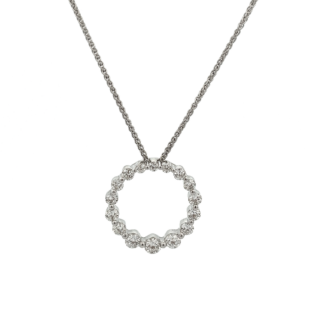 A circle pendant on a 18k white gold chain features round brilliant...