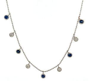 This elegant 14k white gold necklace features round brilliant cut d...