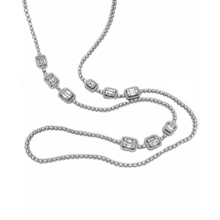 This diamond necklace features baguette and round brilliant cut dia...