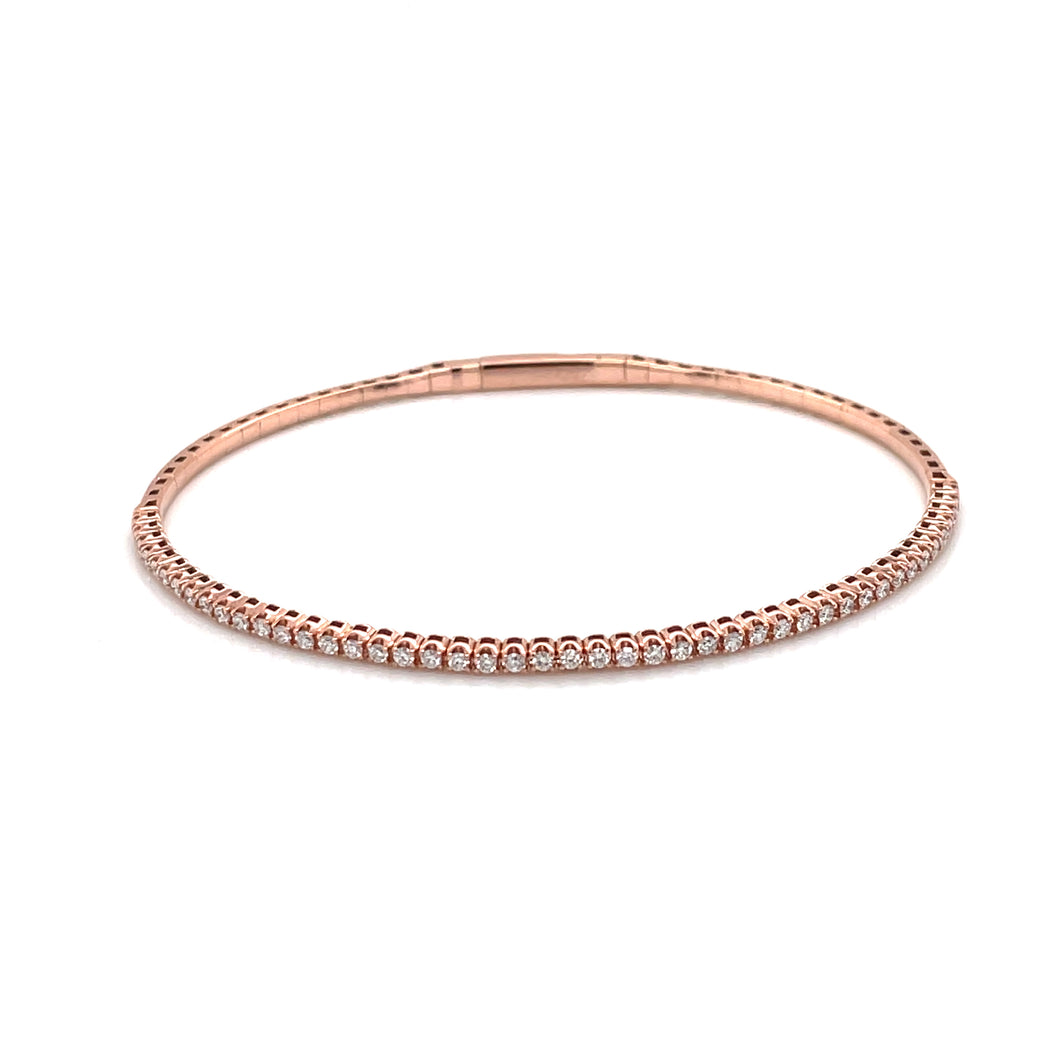 This gorgeous rose gold bangle features round brilliant cut diamond...