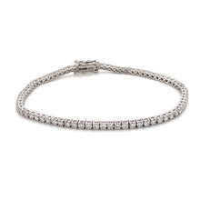 This timeless classic tennis bracelet features approximately 56 bas...