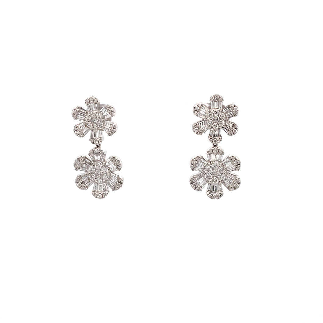 These decadent flower drop earrings feature baguette and round diam...
