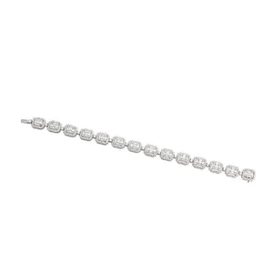 This diamond bracelet features round and baguette diamonds that tot...