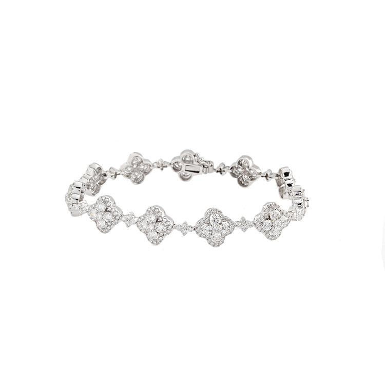 This bracelet features a cluster of round brilliant cut diamonds th...