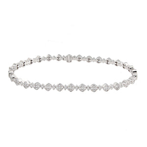 This bracelet features a cluster of round brilliant cut diamonds th...