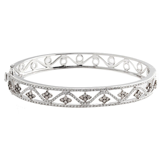 This bangle features white and champagne round brilliant cut diamon...