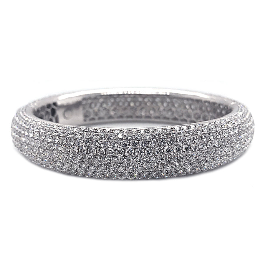 This diamond bangle features round brilliant cut diamond that total...
