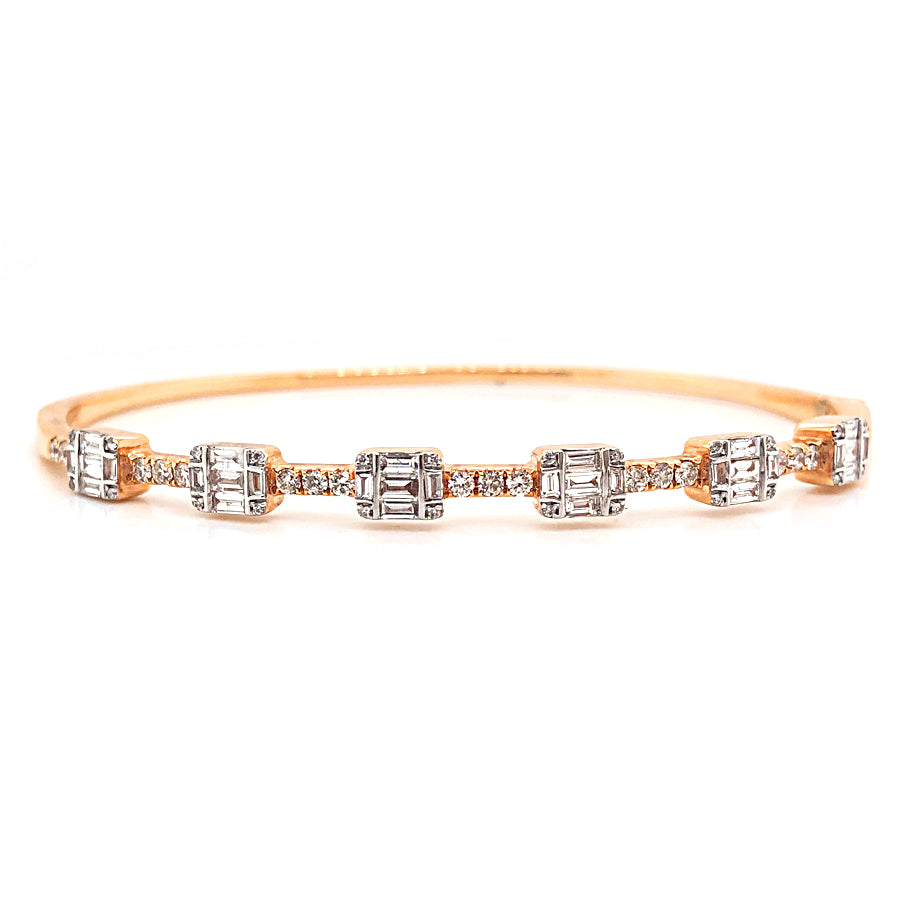 This cuff bracelet features baguette and round brilliant cut diamon...