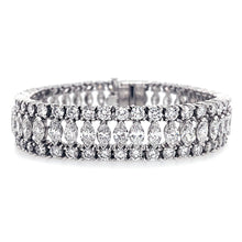 This bracelet features marquise and round brilliant cut diamonds th...