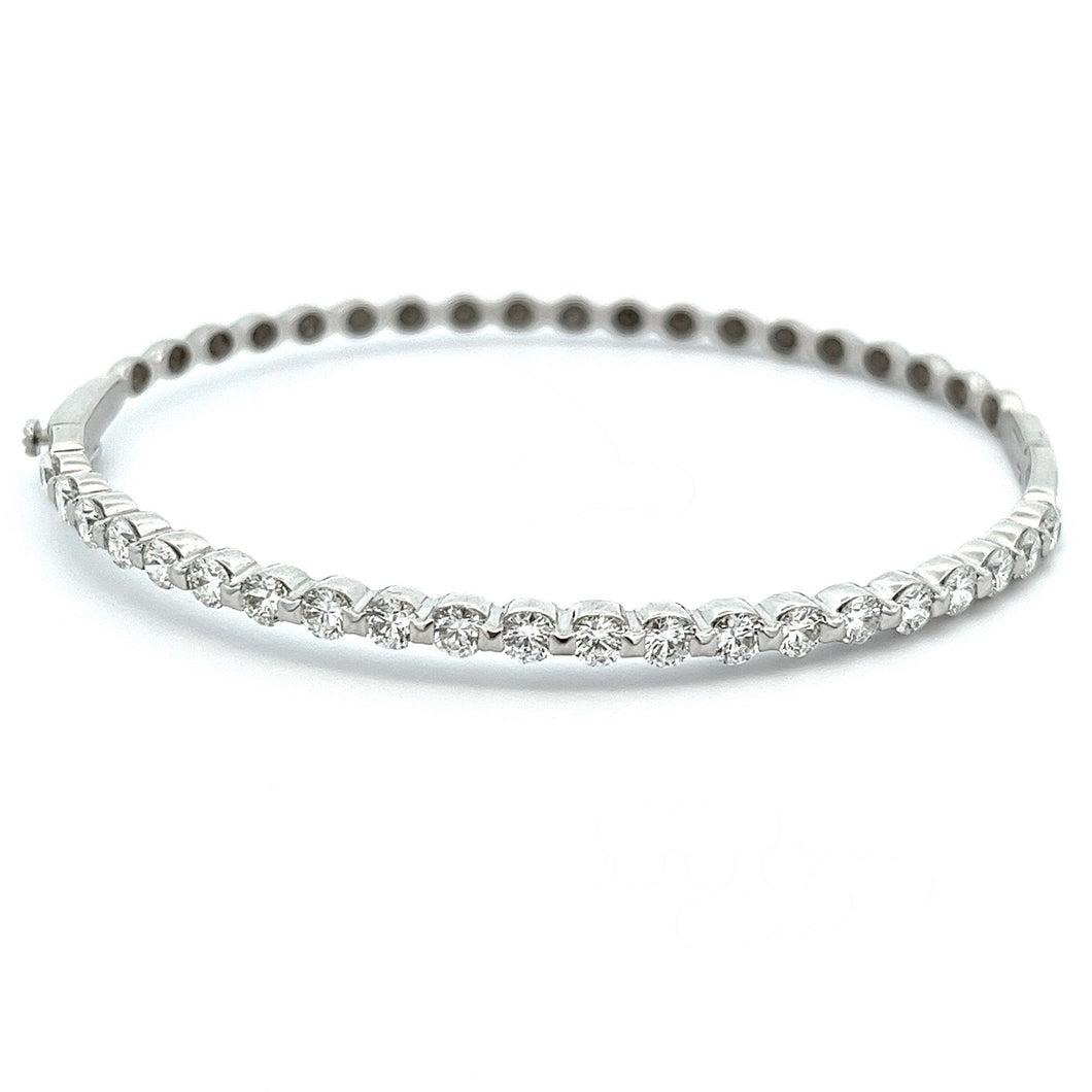This classic 14k white gold bangle features 21 round brilliant cut ...
