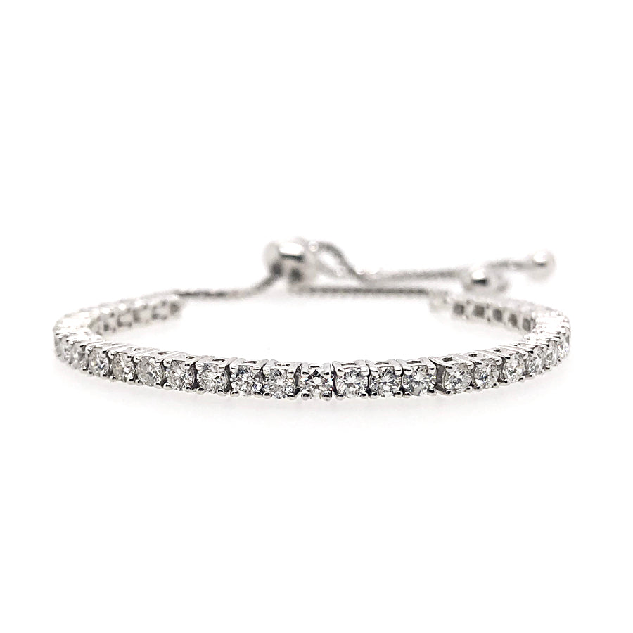 This bracelet feature bezel set round brilliant cut diamonds that t...