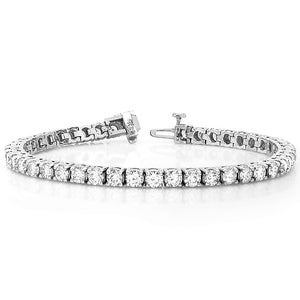 This tennis bracelet features round brilliant cut diamonds that tot...