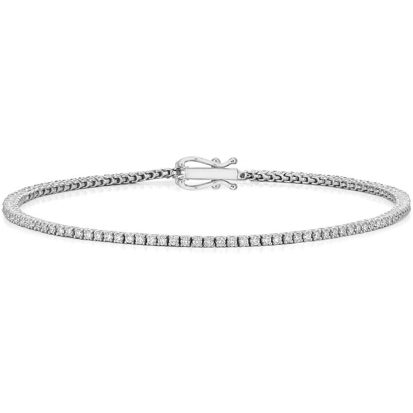 This tennis bracelet features round brilliant cut diamonds that tot...