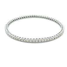 This flexible straight-line stretch bracelet features round brillia...