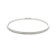 This easy to stack and style 18k white gold bangle features pave-se...