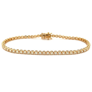 This beautiful 14k yellow gold diamond bracelet features round bril...