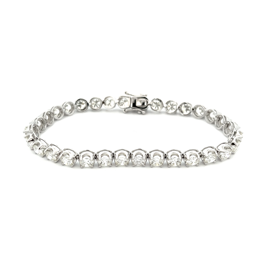 This gorgeous 18k white gold diamond bracelet features 32 round bri...