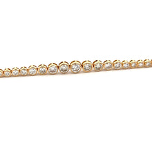 This easy to style bracelet features 75 bezel-set round brilliant c...