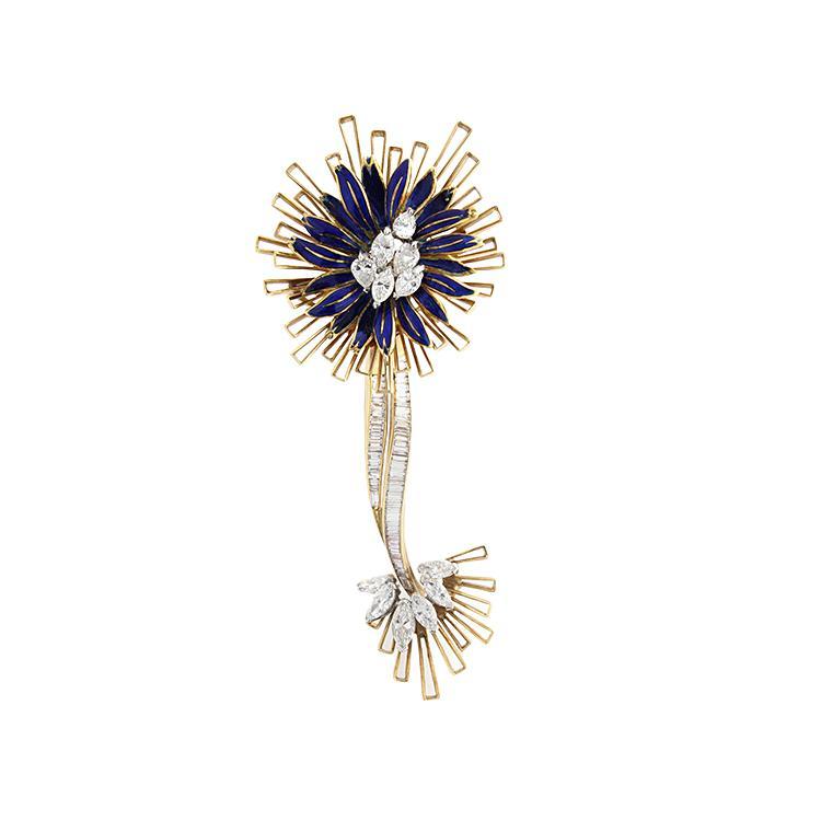 This brooch features diamonds that total 3.67cts with blue enamel.