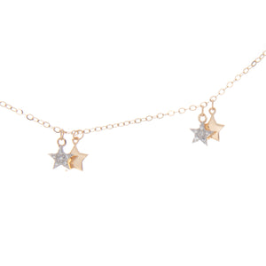 dainty necklace featuring 14k yellow gold mini star pendants, with ...