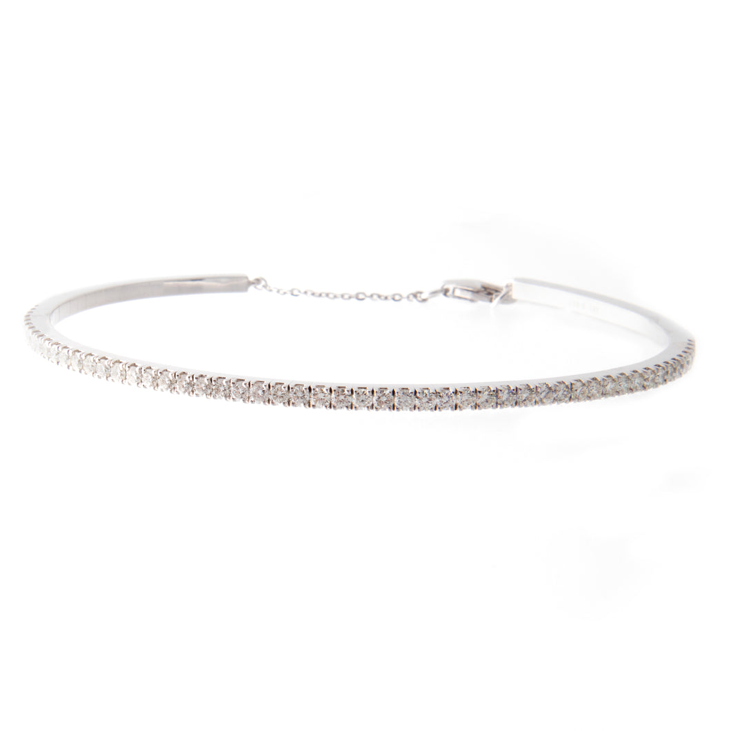 This elegant bangle features a single row of round brilliant cut, p...