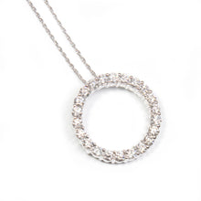 This stunning circle pendant features round brilliant cut diamonds ...