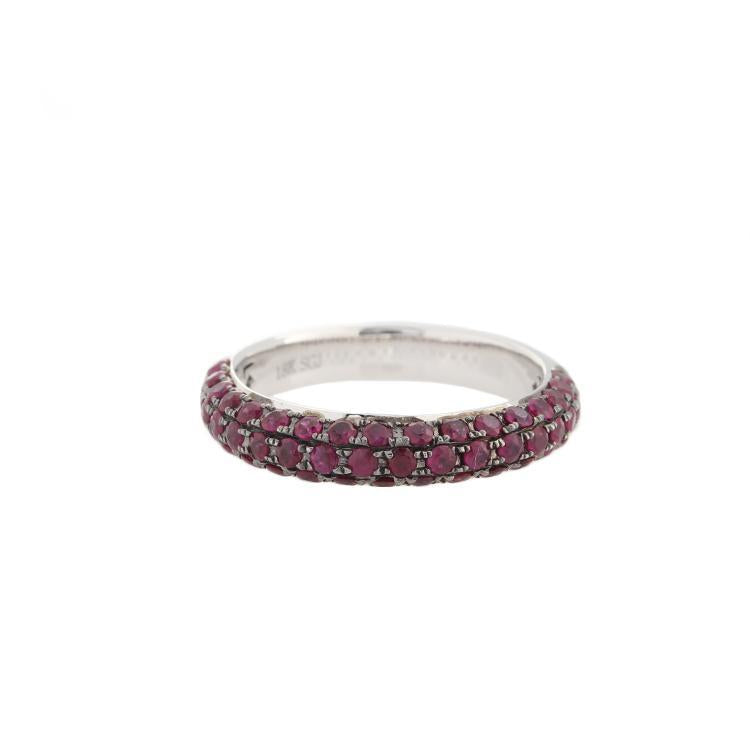 This ring features is in 18k white gold with three rows of rubies s...