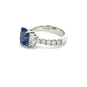 This gorgeous 18k white gold ring features a sapphire that weighs a...