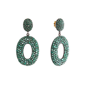 These earrings feature pave set green emeralds that total 12.85cts.