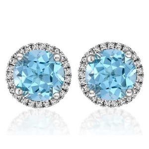 These earrings feature round brilliant cut diamonds that total .20c...