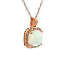 This 14k rose gold necklace features an opal that weighs approx. 1....