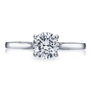 Large crescent motifs give a sweet romance to a solitaire engagemen...