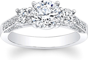 This diamond engagement ring features two round brilliant cut diamo...