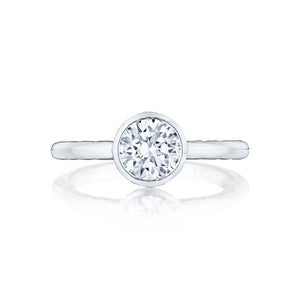For the lover of classics, this timeless round diamond engagement r...